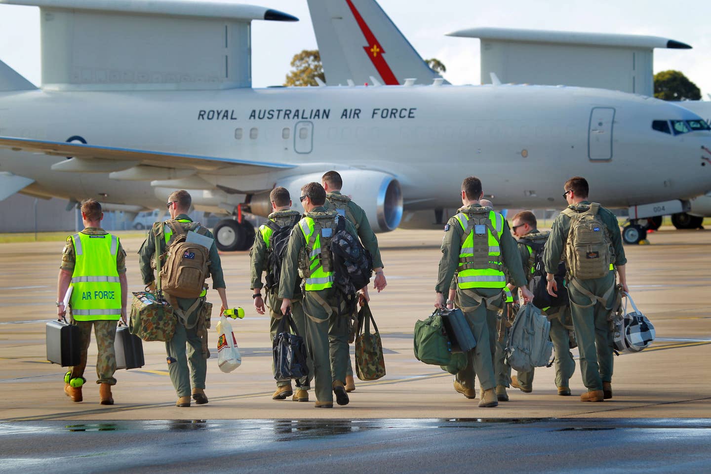 An aircrew prepares to board a Royal Australian Air Force E-7A Wedgetail Airborne Early Warning and Control aircraft. (Photo by CPL Melina Young/Royal Australian Air Force via Getty Images)