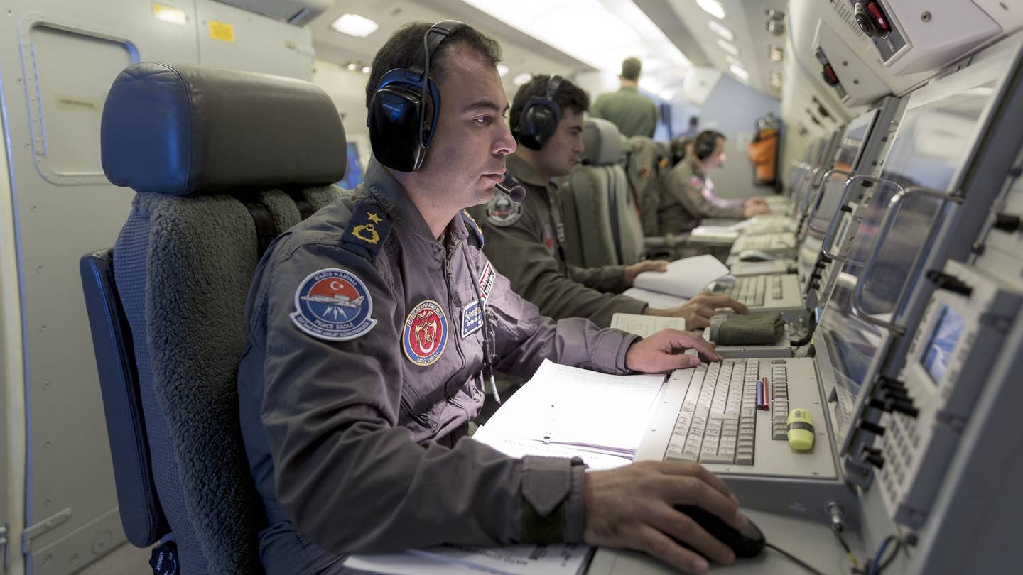 Turkish Air Force mission specialists use the mouse aboard a Turkish Air Force E-7 Wedgetail Airborne Early Warning and Control jet.  (Photo by Orhan Akkanat/Anadolu Agency/Getty Images)