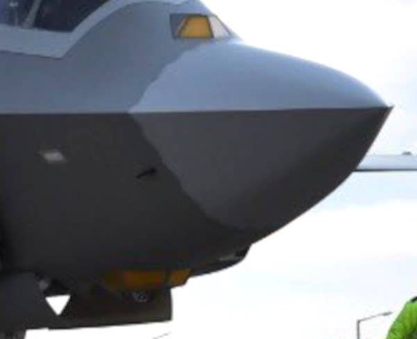 A close-up at the front end of the TF-X prototype showing what appears to be a fixed faceted low-observable enclosure for a dedicated IRST sensor on top of the nose in front of the cockpit, as well as a multi-purpose EOTS underneath the fuselage. <em>SSB</em>