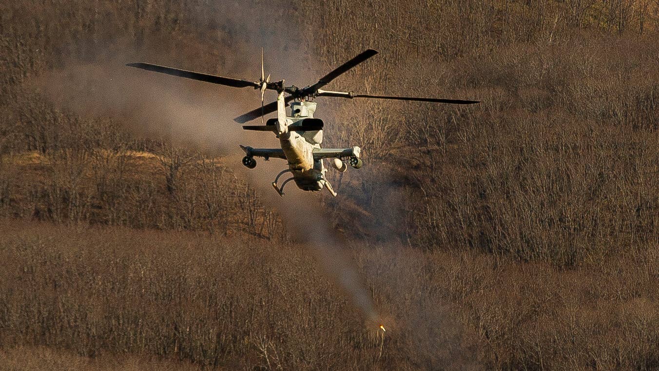 A U.S. Marine Corps AH-1Z Viper with HMLA-369 fires a rocket on the Yausubetsu Training Area in Japan during Exercise Resolute Dragon 21 on Dec. 7, 2021. (U.S. Marine Corps photo by Sgt. Mario A. Ramirez)