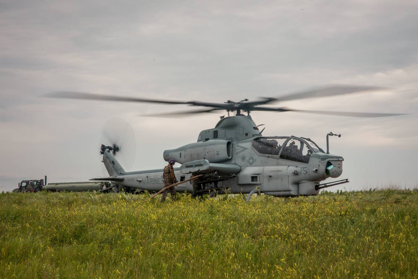 A U.S. Marine Corps AH-1Z Viper from Marine Light Attack Helicopter Squadron (HMLA) 773 Detachment A, 4th Marine Aircraft Wing, receives refueling within a Forward Arming and Refueling Point (FARP) at exercise Gunslinger 22 in Salina, Kansas, June 22, 2022. (U.S. Marine Corps photo by Lance Cpl. David Intriago)