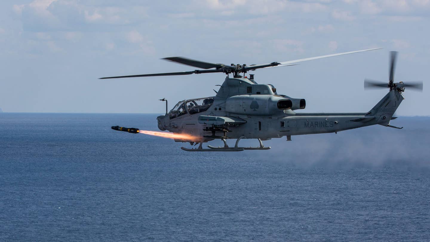 An AH-1Z Viper with Marine Light Attack Helicopter Squadron (HMLA) 267, 3rd Marine Aircraft Wing, fires an AGM-114 Hellfire missile at Range 176, Okinawa, Japan. (U.S. Marine Corps photo by MCIPAC Combat Camera Lance Cpl. Sean M. Evans)