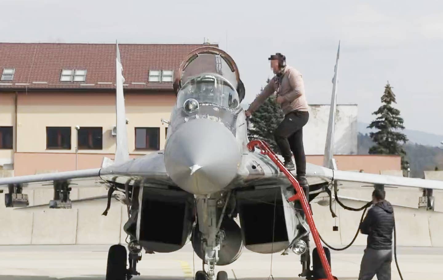 A Ukrainian pilot prepares to fly a Slovakian-donated MiG-29 Fulcrum back home. (Slovakian Defense Ministry screen cap)