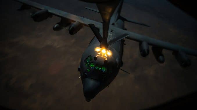An AC-130 refuels from a KC-135. Low altitude refueling does provide an increase in survivability against long-range air defense systems. (U.S. Air Force photo by Staff Sgt. Trevor T. McBride)