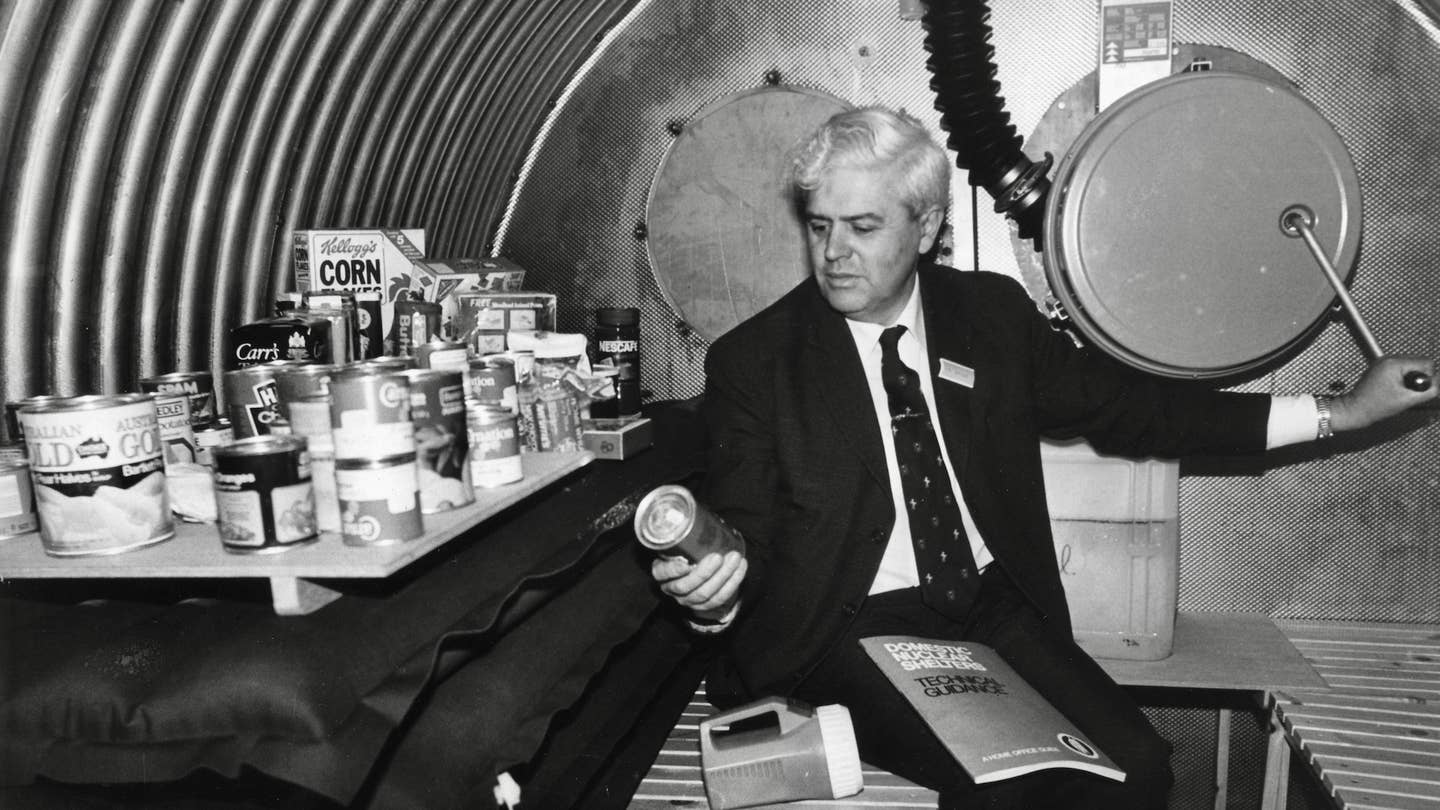 Interior of a domestic nuclear shelter with an intake air pump and a supply of food