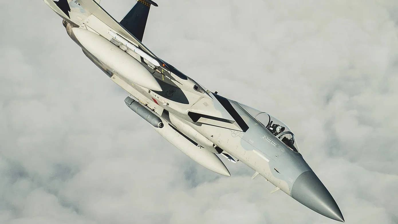 A US Air Force F-15C Eagle fighter jet carrying a Lockheed Martin Legion Pod fitted with an infrared search and track (IRST) system. <em>USAF</em>