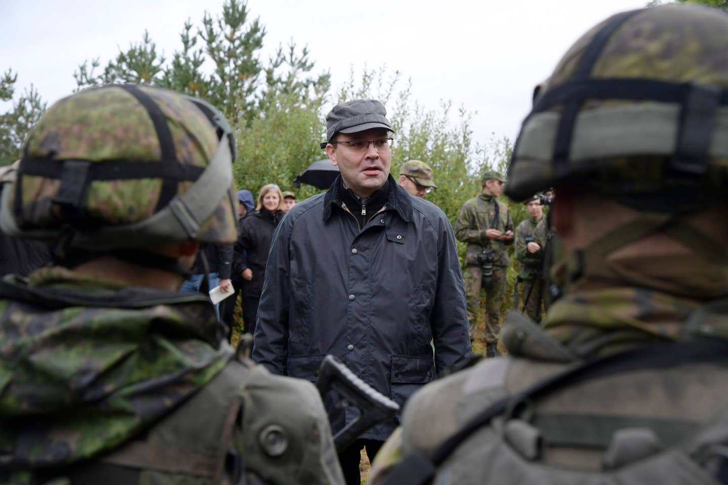 The then-Finnish Minister of Defense Jussi Niinisto inspects Finnish troops during joint maneuvers with Swedish troops in September 2017. <em>ANDERS WIKLUND/AFP via Getty Images</em>
