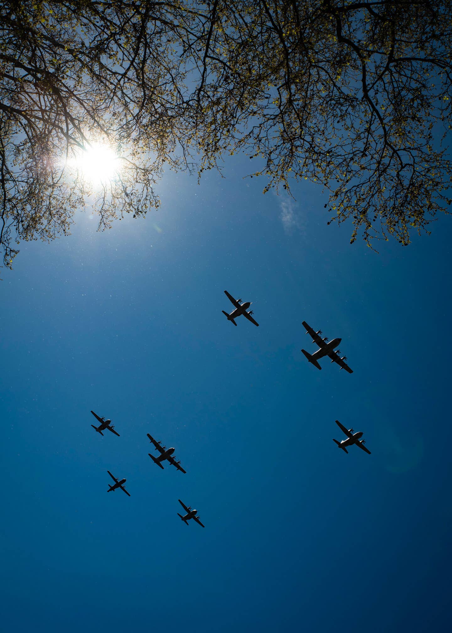 Italian Air Force turboprops in formation over Rome. The C-130J and C-27J transports are followed by a single P-72 maritime patrol aircraft. <em>Daniele Faccioli </em>