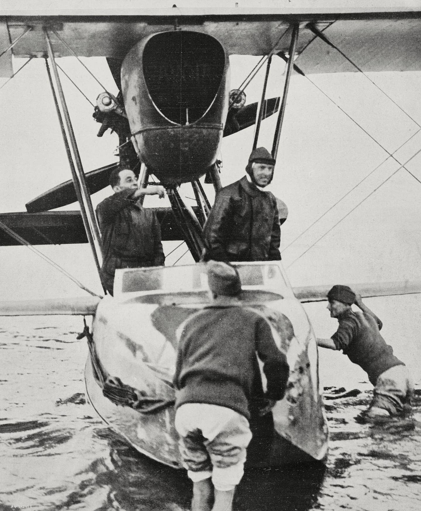 Commander Francesco De Pinedo and his mechanic Ernesto Campanelli aboard the seaplane they flew to Melbourne and Tokyo. The photo was taken at the port of Taranto, Italy, in November 1925. <em>Getty Images</em>