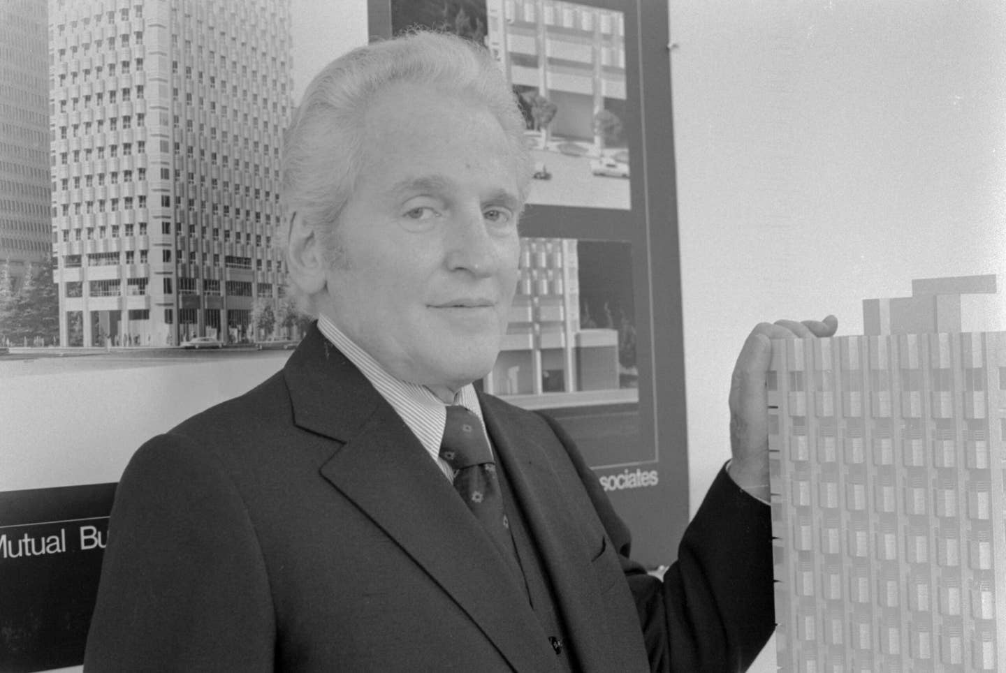 Architect William L. Pereira stands next to an architectural model. <em>Photo by © Roger Ressmeyer/CORBIS/VCG via Getty Images</em>