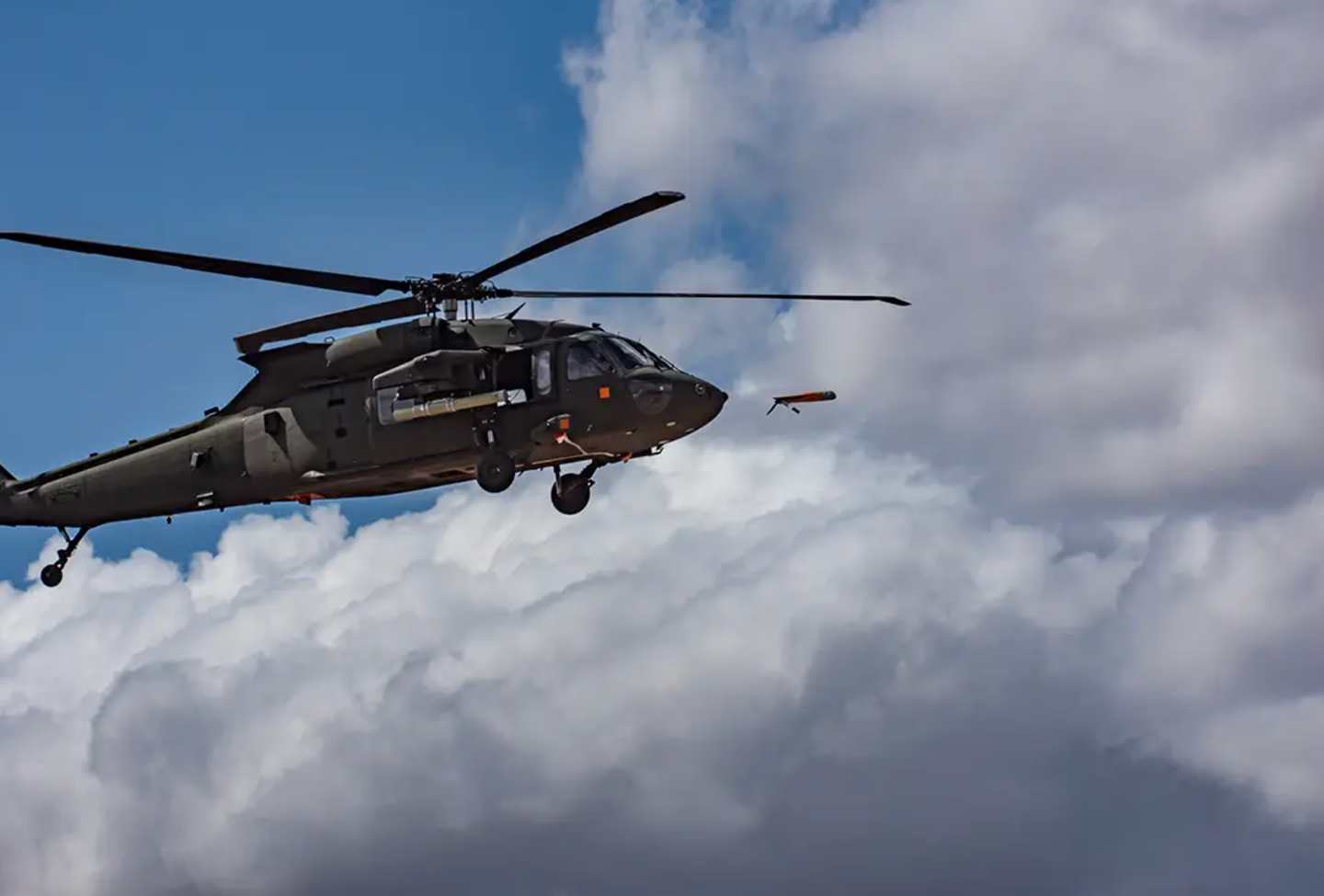 A U.S. Army UH-60 Black Hawk helicopter launches an ALTIUS-600 via a Common Launch Tube (CLT) during a test.&nbsp;<em>U.S. Army</em>