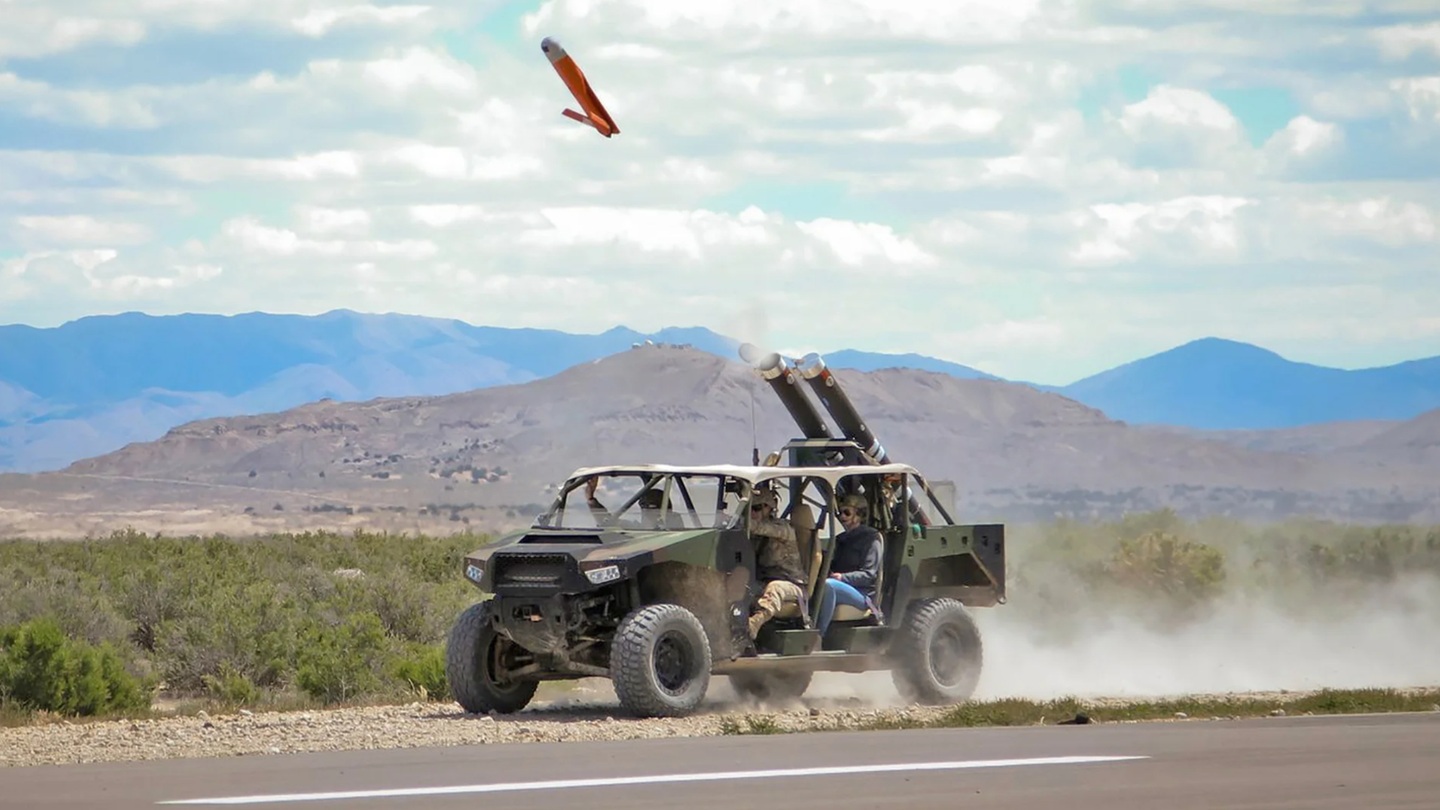 A light vehicle fitted with a pair of Pneumatically Integrated Launch Systems (PILS) launches an ALTIUS-600 as part of a U.S. Army test.&nbsp;<em>U.S. Army</em>