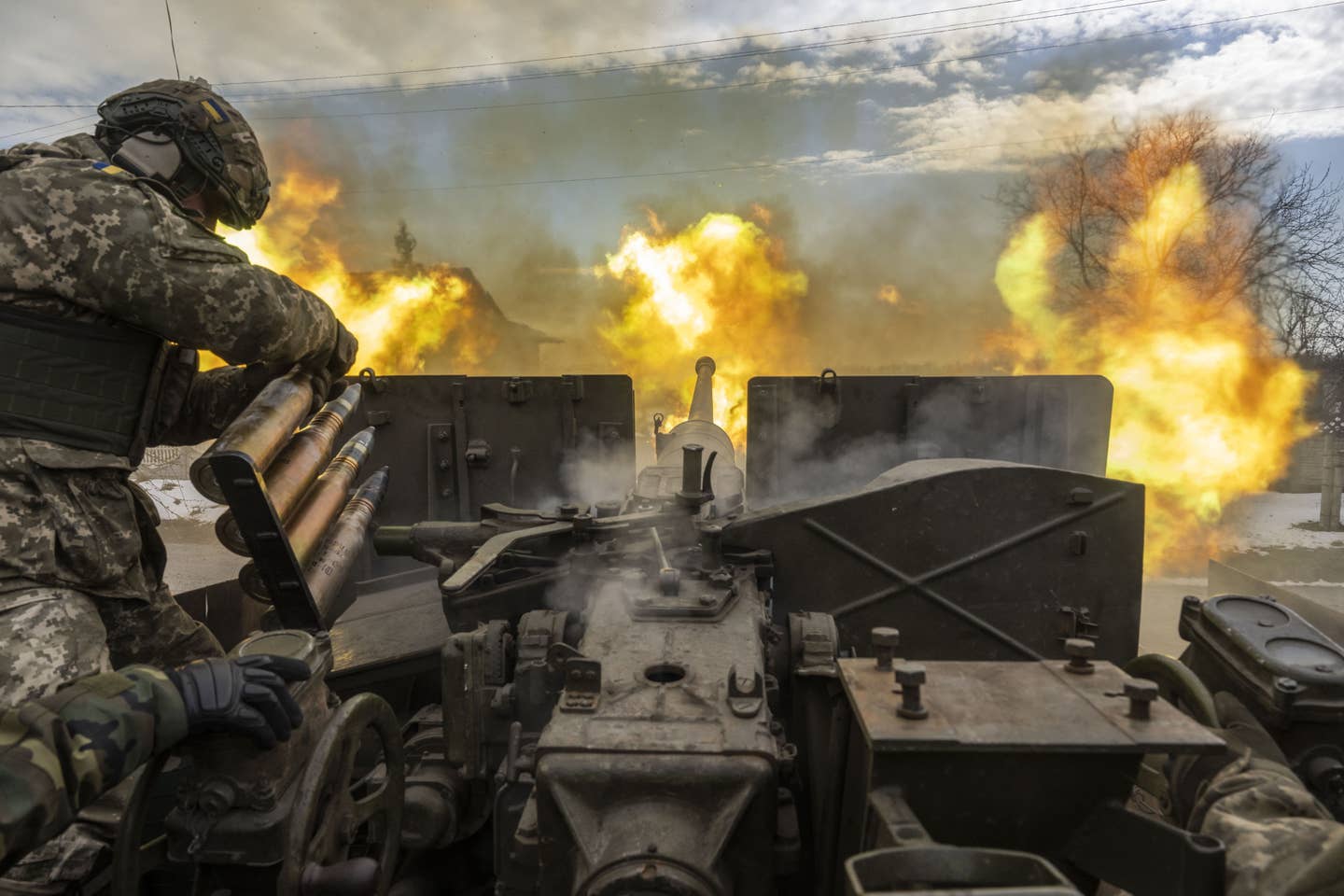 Ukrainian servicemen fire an artillery shell near the frontline area amid the Russia-Ukraine war, in Bakhmut, Ukraine on April 2, 2023. (Photo by Muhammed Enes Yildirim/Anadolu Agency via Getty Images)