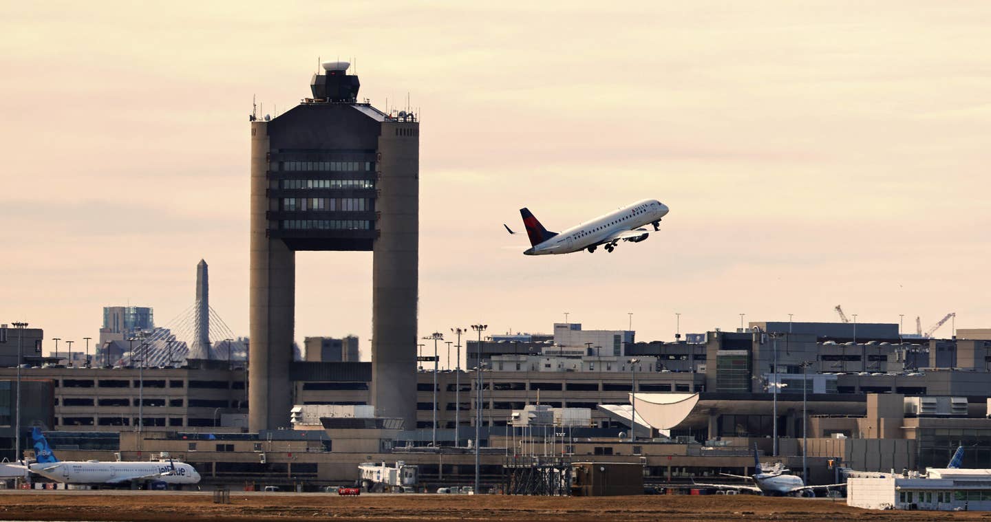 The air traffic control tower at Boston's Logan International Airport. <em>Credit: Photo by Pat Greenhouse/The Boston Globe via Getty Images</em>