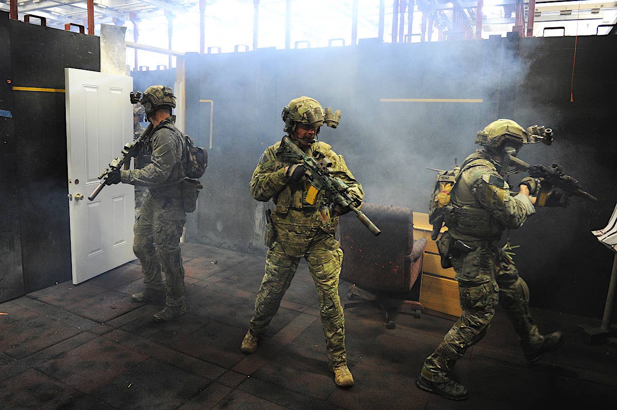 Members of the FBI's Hostage Rescue Team (HRT) during room clearing training in a shoothouse. <em>Matt McClain/ The Washington Post via Getty Images </em>