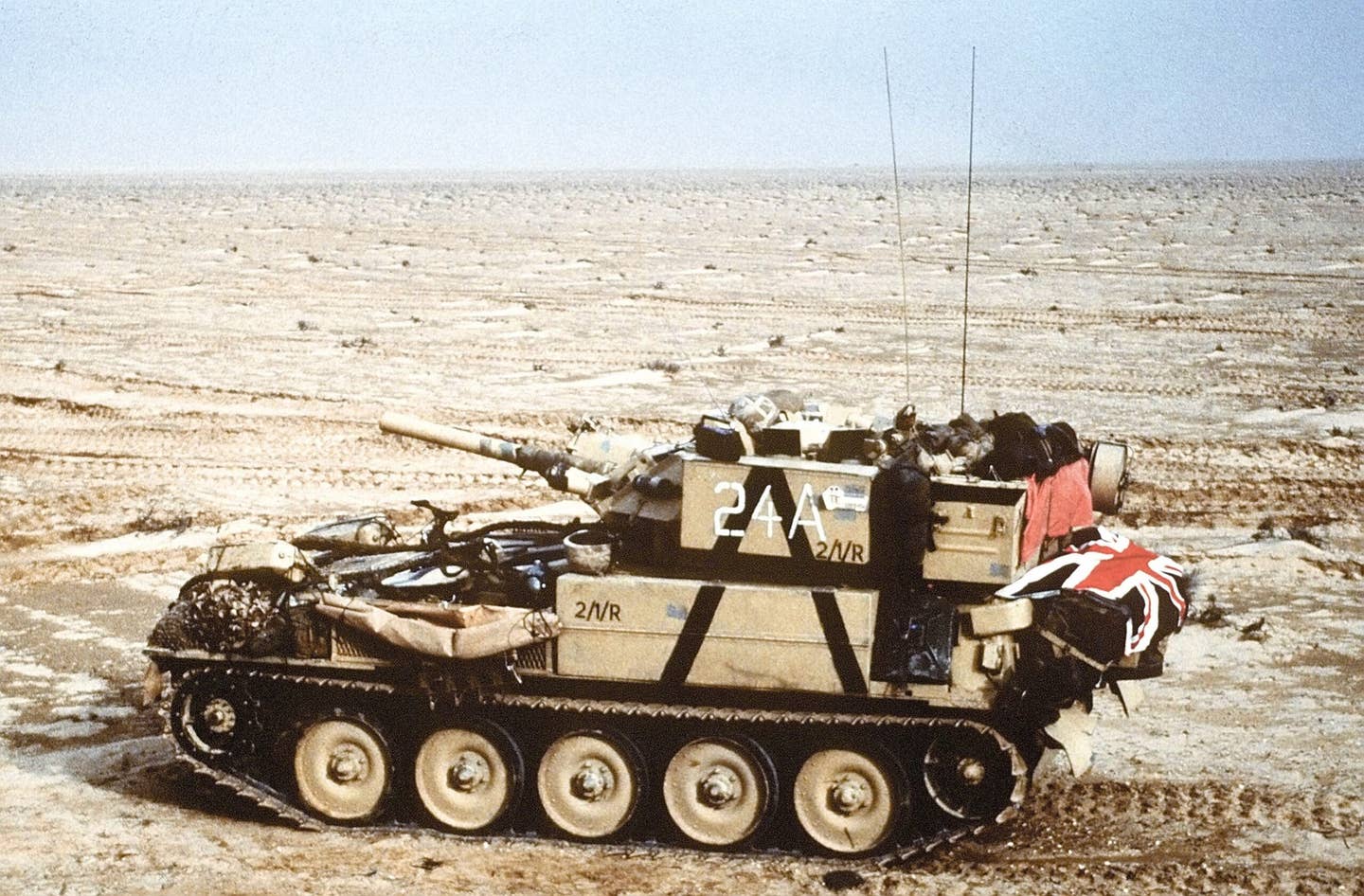 A Scorpion reconnaissance vehicle of the 7th Brigade Royal Scots, 1st United Kingdom Armored Division, advances east into Kuwait from southern Iraq during Operation Desert Storm. <em>Credit: PHC HOLMES/Wikimedia Commons</em>