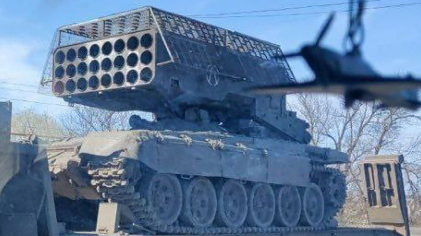 Russian add a cope cage to the TOS-1A MLRS.