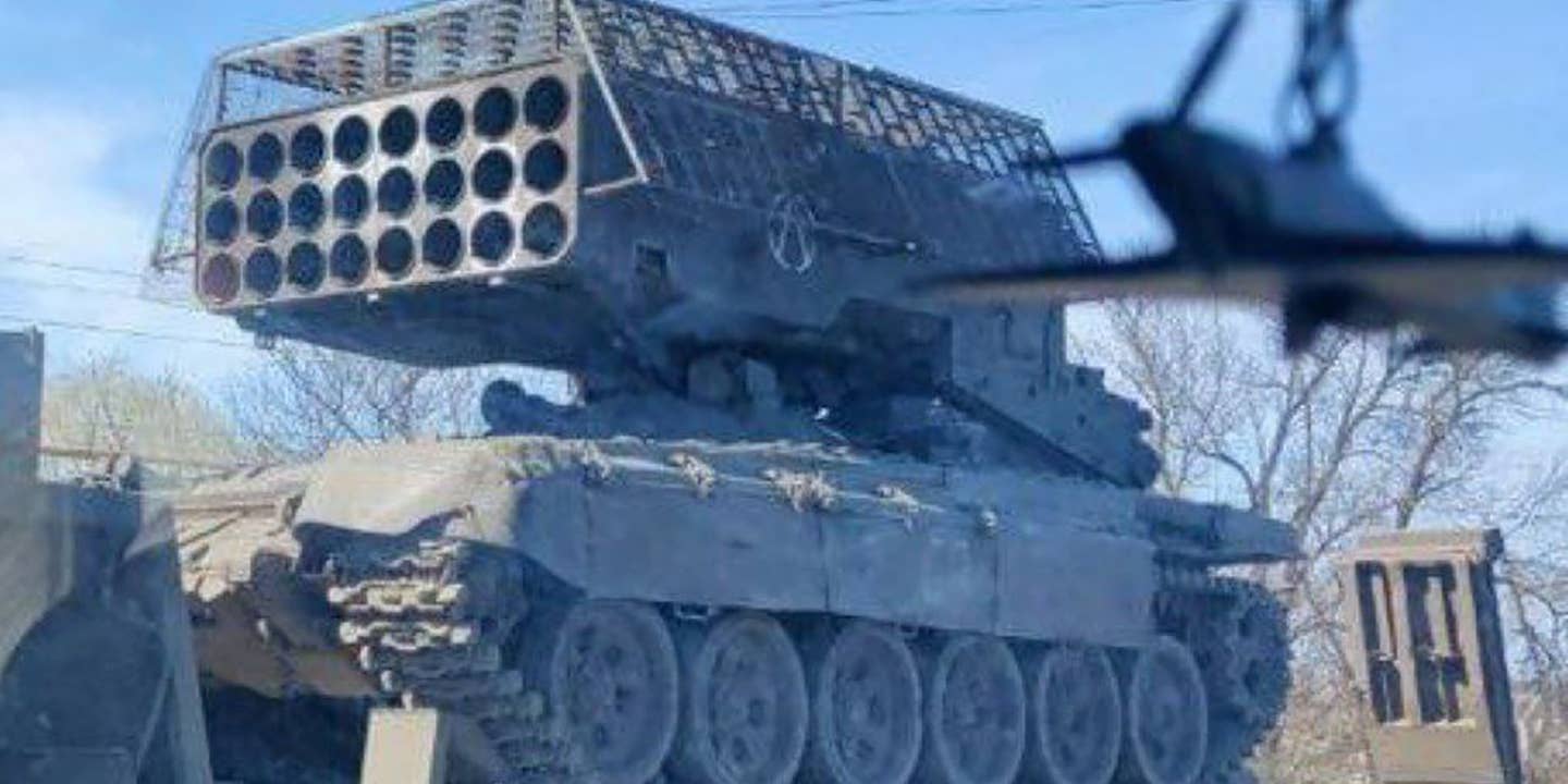 Russian add a cope cage to the TOS-1A MLRS.