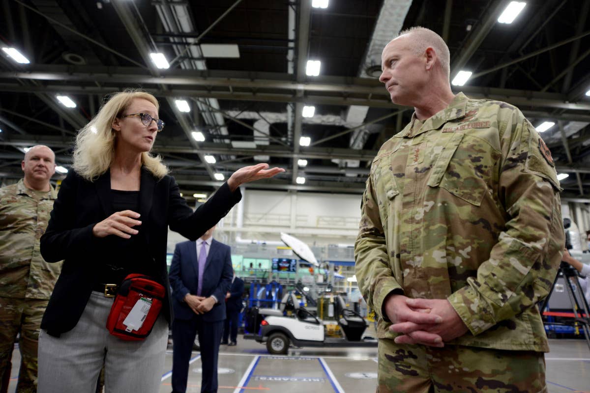 Lockheed Martin F-35 Program Vice President and General Manager Bridget Lauderdale, at left, talks with Lt. Gen. Schmidt, at right, during a visit to Lockheed Martin’s Air Force Plant 4 in Fort Worth, Texas, on November 3, 2022. <em>USN</em>