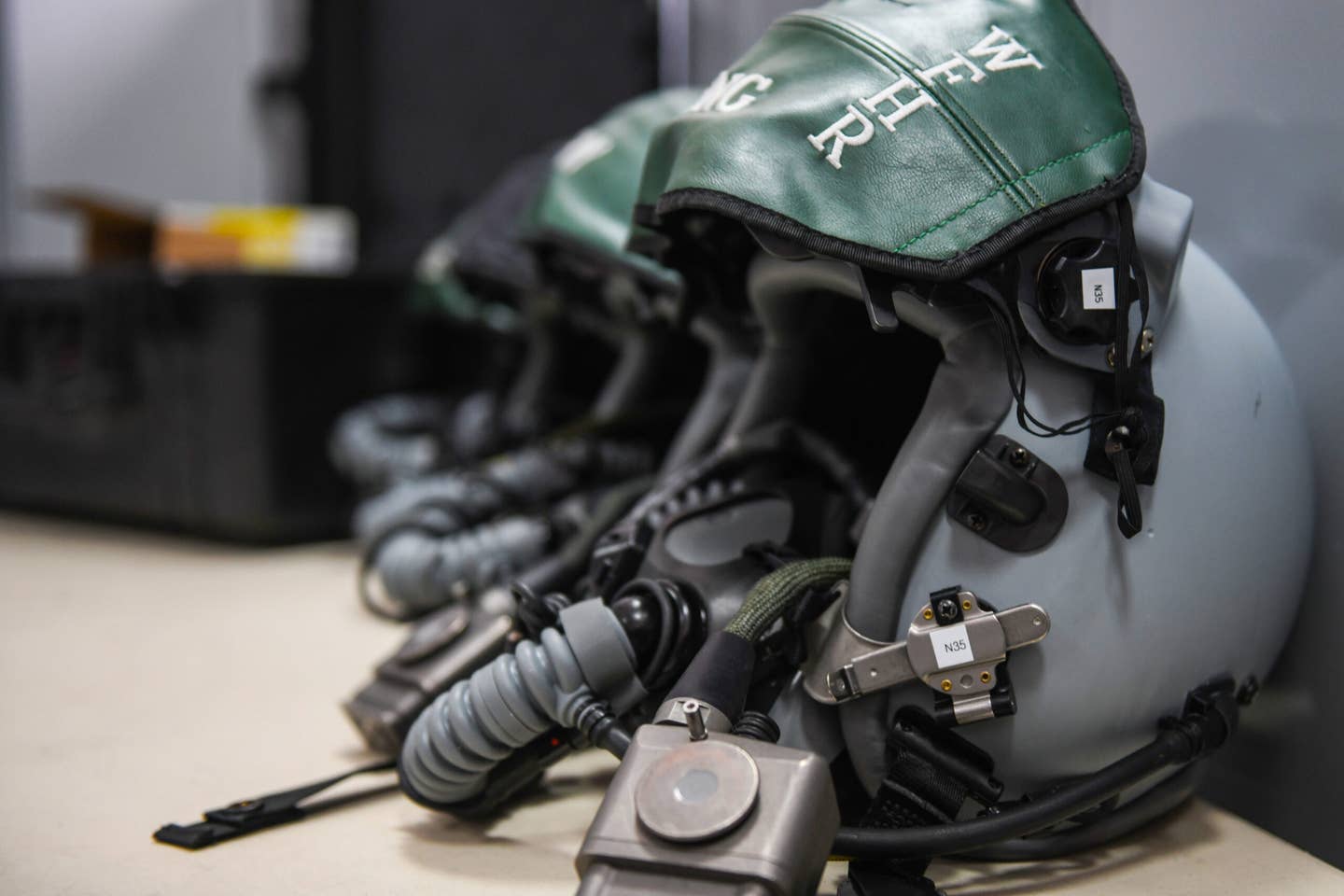 Four HGU-55/P Joint Helmet Mounted Cueing Systems sit on a table at Graf Ignatievo Air Base, Bulgaria. <em>Credit: U.S. Air Force photo by Airman 1st Class Ericka A. Woolever</em>