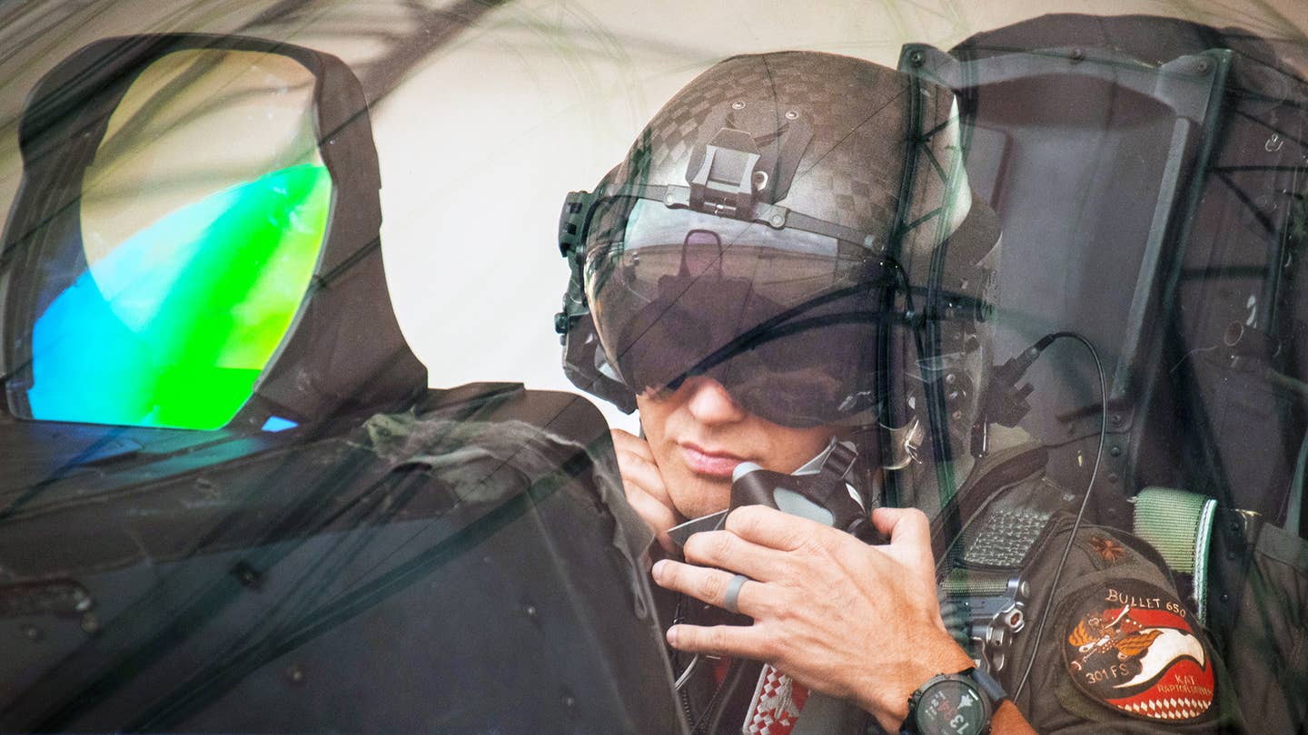 Maj. Brett Gedman, 301st Fighter Squadron, readies for a mission wearing the Next Generation Fixed Wing Helmet March 24 at Eglin Air Force Base, Fla.<em> Credit: U.S. Air Force photo/Samuel King Jr.</em>