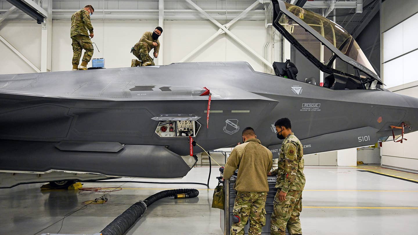 U.S. Air Force maintainers at Hill Air Force Base in Utah work on an F-35A. <em>USAF</em>