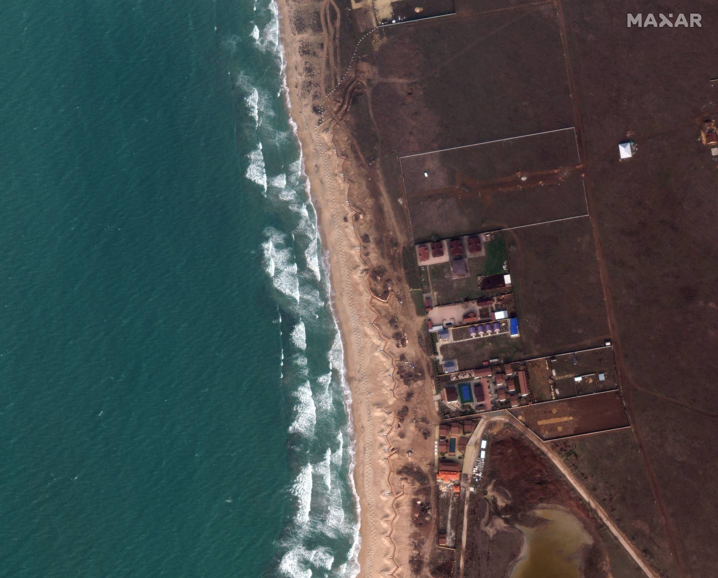 The Russians have built dragon's teeth and trenches along the beach west of Yevpatoria, Crimea. Satellite image ©2023 Maxar Technologies.<br><br>