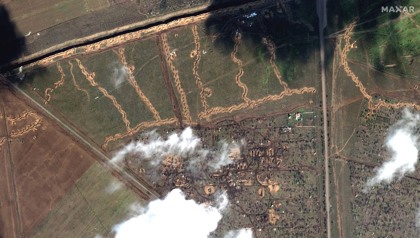 Trenches and deployed vehicles north of Armiansk, Crimea. Satellite image. ©2023 Maxar Technologies.