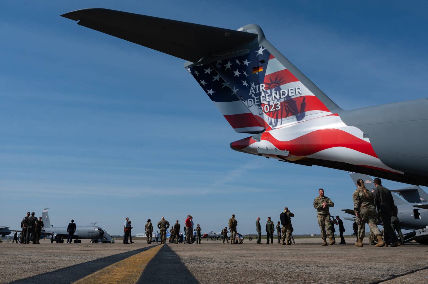 German and U.S. media and service members walk on the flight line during an Air Defender 2023 media event at Joint Base Andrews, Maryland, April 5, 2023. <em>Credit: U.S. Air National Guard photo by Tech. Sgt. Sarah M. McClanahan</em>