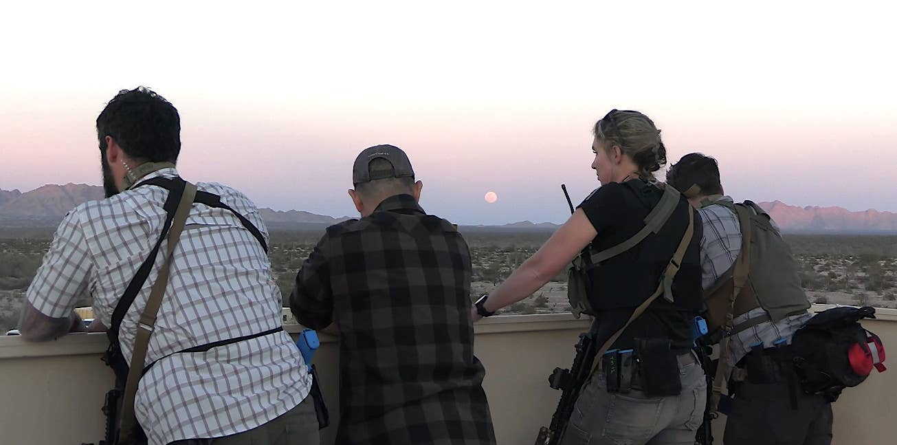 What appear to be U.S. State Department  Diplomatic Security Service (DSS) personnel on the roof of the consulate during the exercise. <em>USMC capture</em>