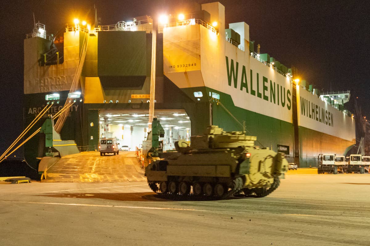A Bradley bound for Ukraine is loaded onto the <em>ARC Integrity</em> in Charleston, South Carolina, ahead of the ship's voyage to Germany earlier this year. <em>TRANSCOM</em>