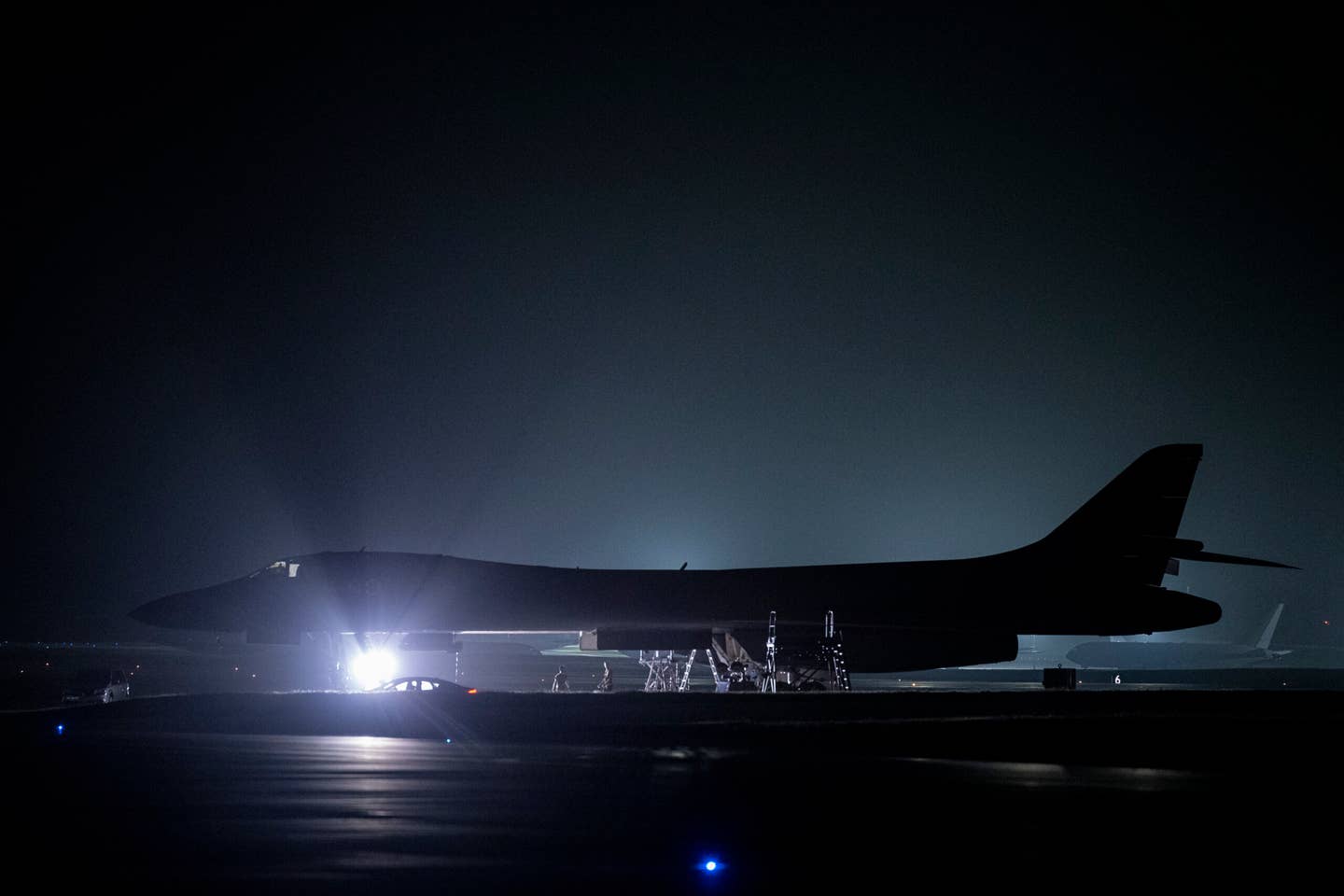 A B-1B Lancer assigned to the 34th Expeditionary Bomb Squadron receives a post-flight inspection upon landing at Andersen Air Force Base, Guam, after participating in Aero India 23, February 18, 2023. <em>U.S. Air Force photo by Tech. Sgt. Rion Ehrman</em>