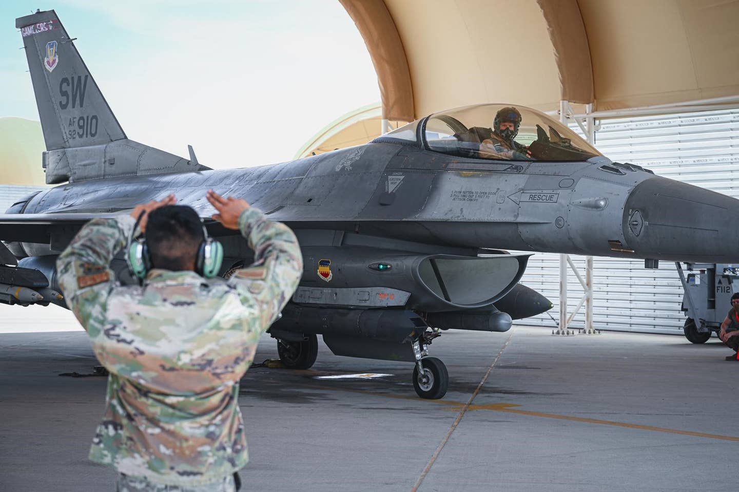 Lt. Gen. Alexus Grynkewich, head of Air Forces Central, prepares to head out on a combat mission in an F-16C Viper assigned to the 77th Expeditionary Fighter Squadron on April 4, 2023. <em>USAF</em>