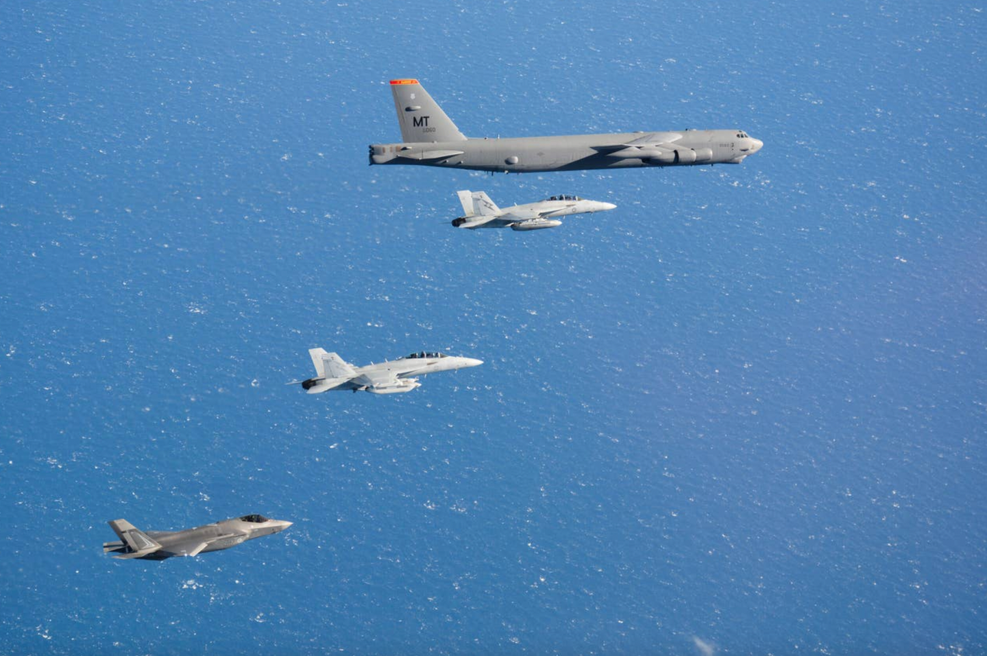 A RAAF F-35A, EA-18G Growler, and F/A-18F Super Hornet fly alongside a U.S. Air Force B-52H from the 23rd Expeditionary Bomb Squadron based at Guam during Exercise Talisman Sabre 21.&nbsp;<em>Australian Department of Defense</em>