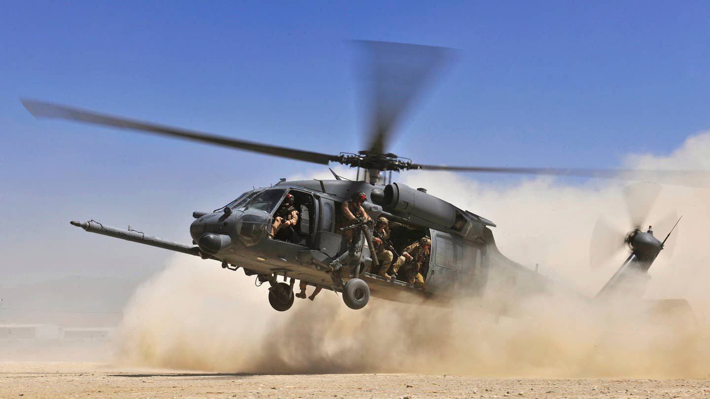 An HH-60G Pave Hawk helicopter carrying combat search and rescue Airmen approaches a landing zone during an exercise at Bagram Airfield, Afghanistan, Aug. 21. 2010. <em>U.S. Air Force photo/Staff Sgt. Christopher Boitz</em>
