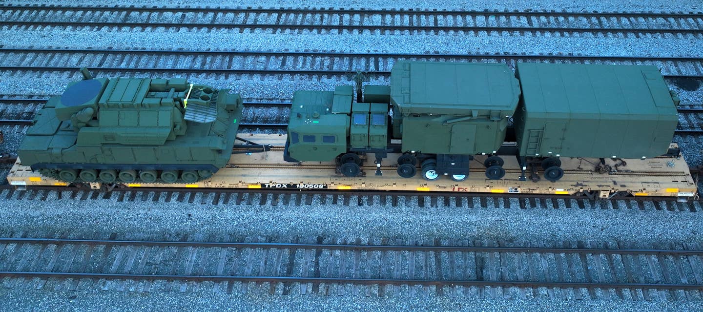 The other railcar with the Tor-M1 and the 5N63/30N6 radar vehicle, or what could be very well-made surrogates, to the left and right, respectively. <em>Joseph Zadeh&nbsp;/ @aboveaverage.joe</em>