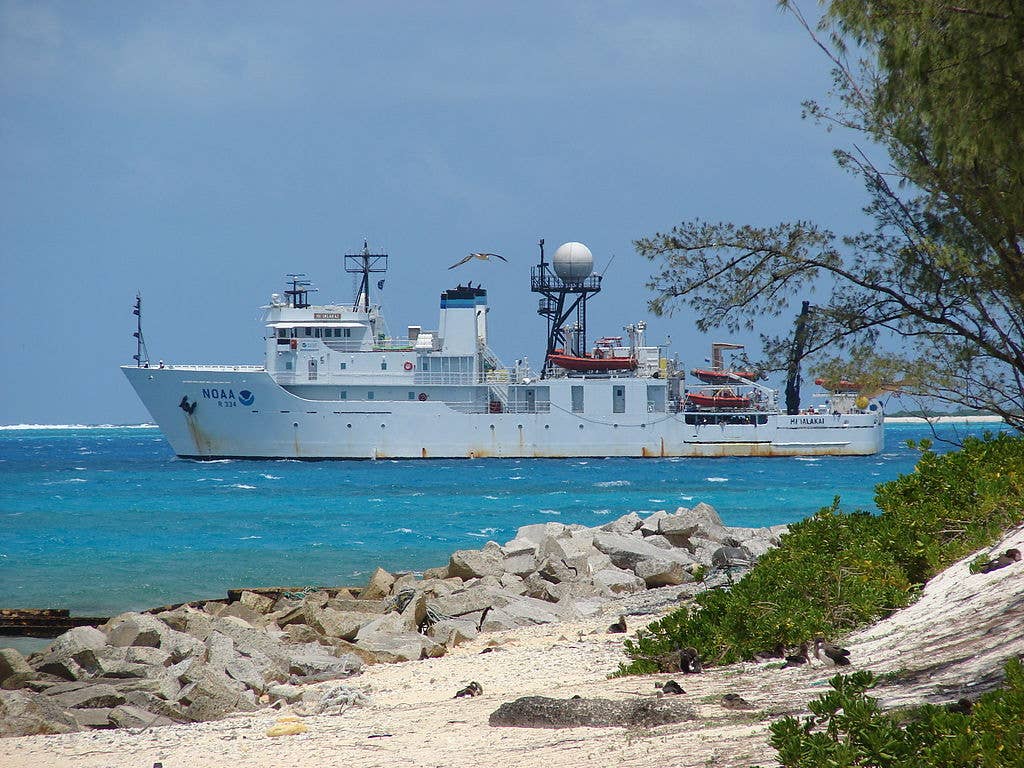 NOAA Research Ship<em> Hi'Ialakai</em>&nbsp;off Rocky point Sand Island, Midway Atoll, June 11, 2008. <em>Forest &amp; Kim Starr</em>