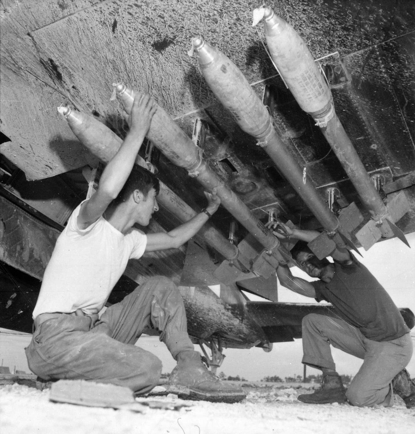 Five-inch FFARs being loaded under the wing of a U.S. Marine Corps F4U&nbsp;Corsair&nbsp;on Okinawa, Japan, circa June 1945.&nbsp;<em>U.S. Marine Corps</em>