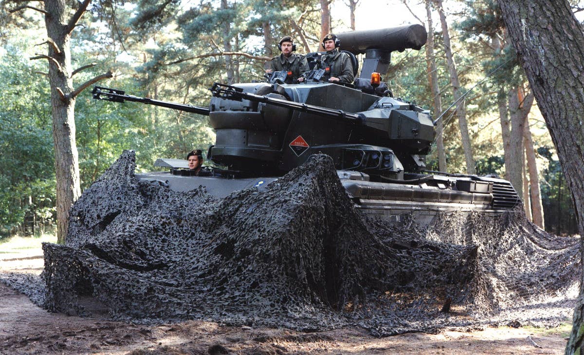 A Dutch Gepard seen during an exercise in 1990. Its distinctive radars are seen at the front and rear of the turret. <em>Dutch Ministry of Defense</em>
