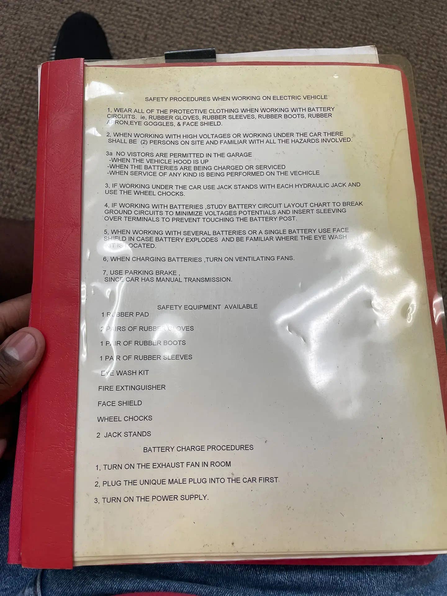 A safety guide found with the Corvette in 2022. Note the line that no visitors are allowed in the garage when the hood is up, the batteries are being charged, or any kind of service is being performed. <em>Kevin Williams</em>