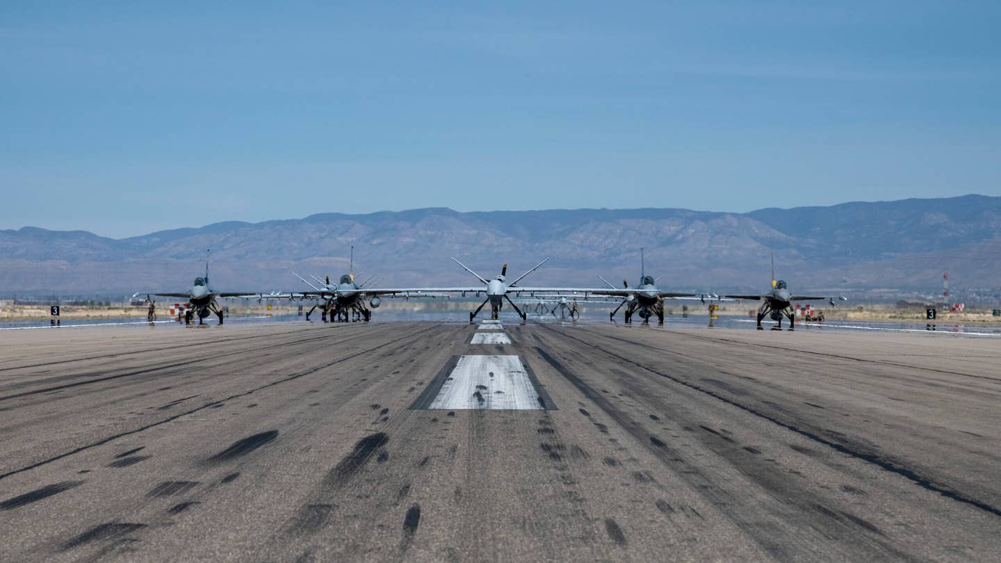 F-16s and MQ-9s assigned to the 49th Wing line up on the runway. <em>U.S. Air Force photo by Capt. Savanah Koontz</em><br>