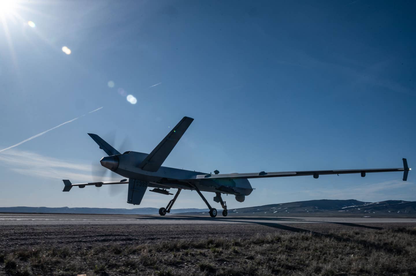 An MQ-9 Reaper lands on Highway 287 during Exercise Agile Chariot, April 30, 2023. <em>U.S. Air Force photo by Tech. Sgt. Carly Kavish</em>
