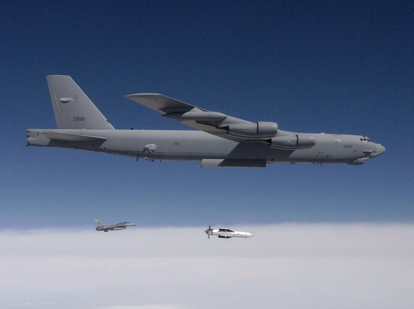 A B-52 releases a test version of the Massive Ordnance Penetrator (MOP) during a test of the weapon over White Sands Missile Range, New Mexico, in 2009. <em>DoD</em>