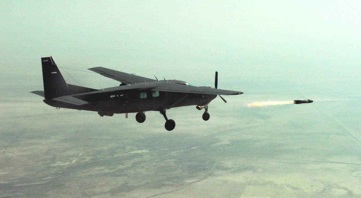 An Iraqi AC-208 fires a Hellfire missile during training in 2010. <em>DOD</em>
