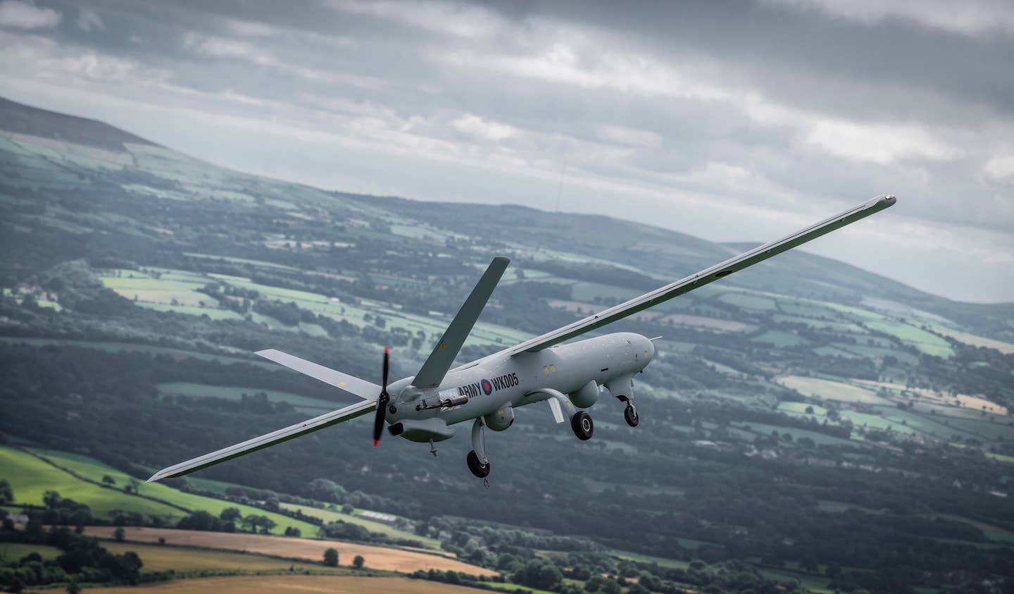 A Watchkeeper WK450 Remotely Piloted Air System RPAS in flight over the U.K. during a test flight. Watchkeepers have reportedly struggled to operate in the British climate. <em>British Army</em>
