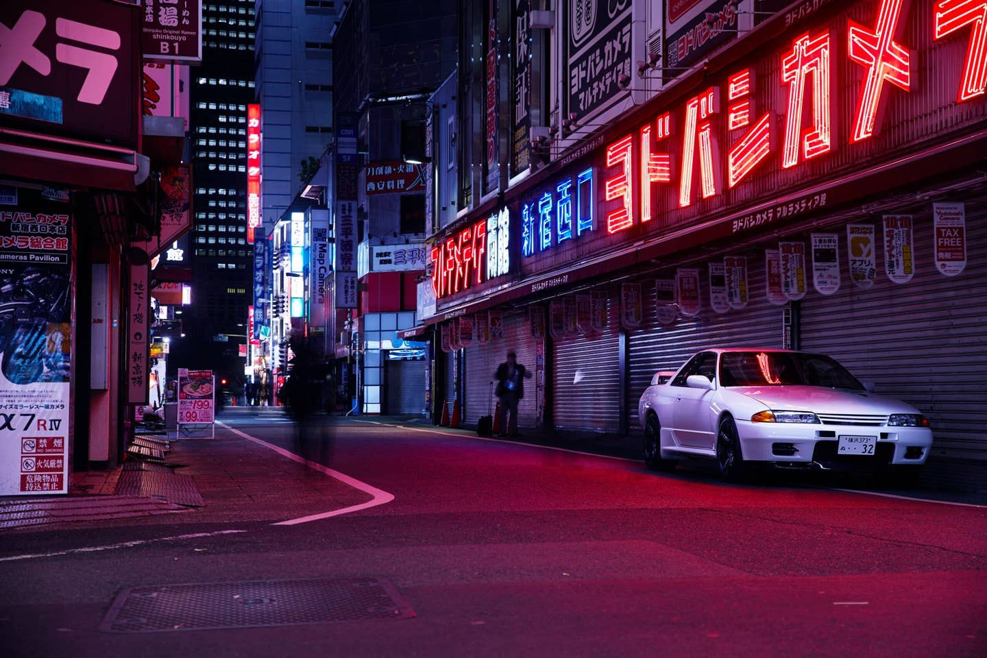 Nissan GT-R by Built By Legends along a Japanese street at night.