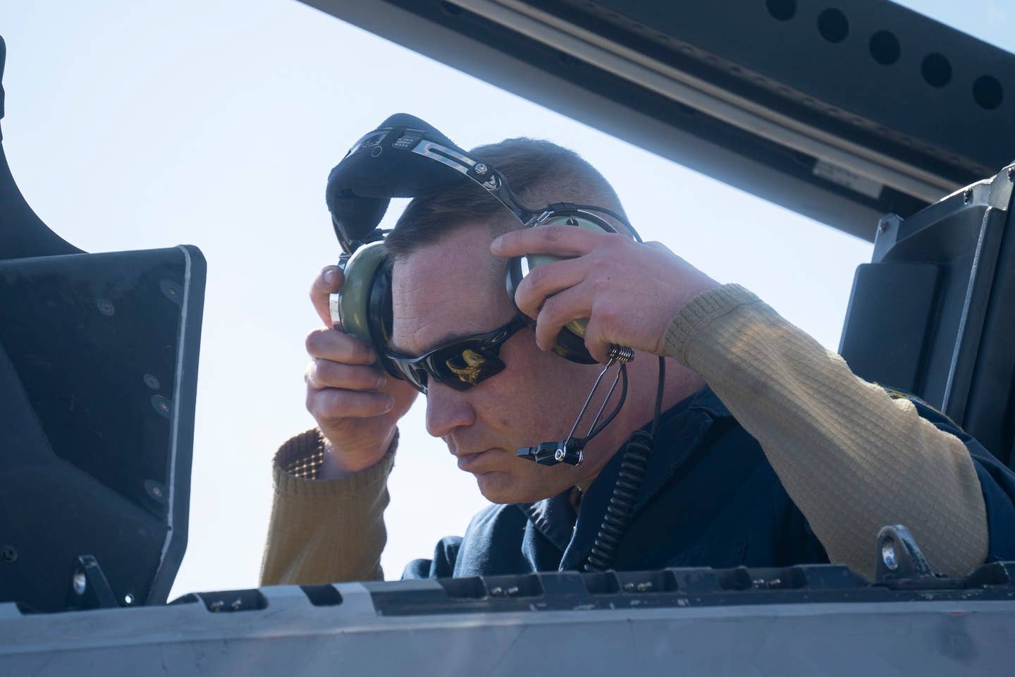 U.S. Air Force Master Sgt. Joshua Eller equips his headset in preparation for the afterburner run. <em>U.S. Air Force photo by Airman 1st Class J. Michael Peña</em>