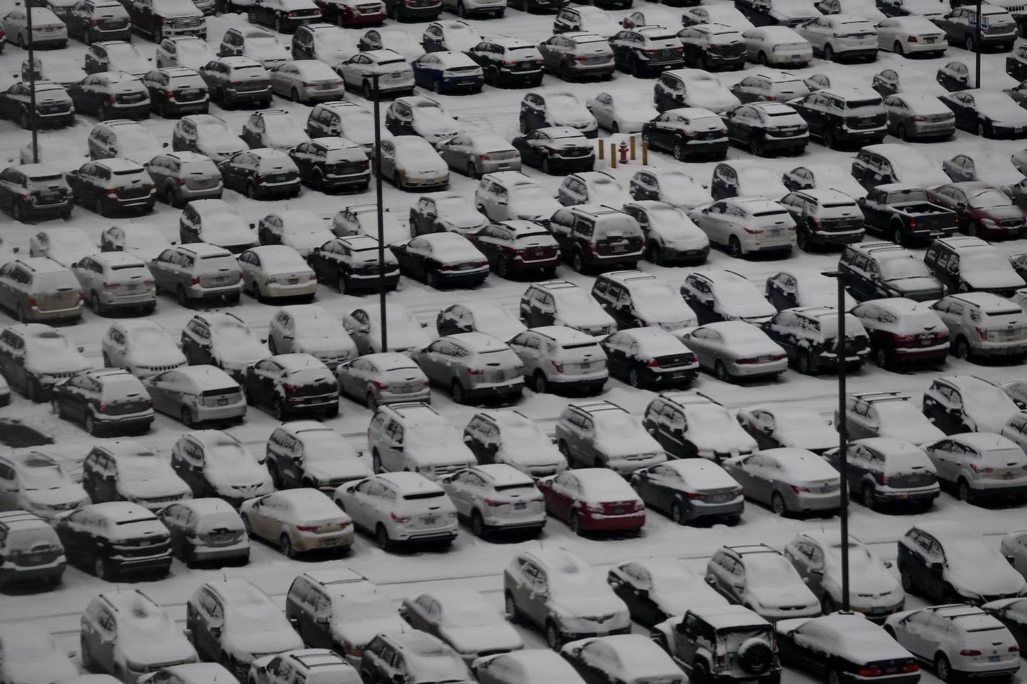 Cars parked at an airport in Bloomington, Minnesota in 2018. <em>Timothy A. Clary via Getty Images</em>