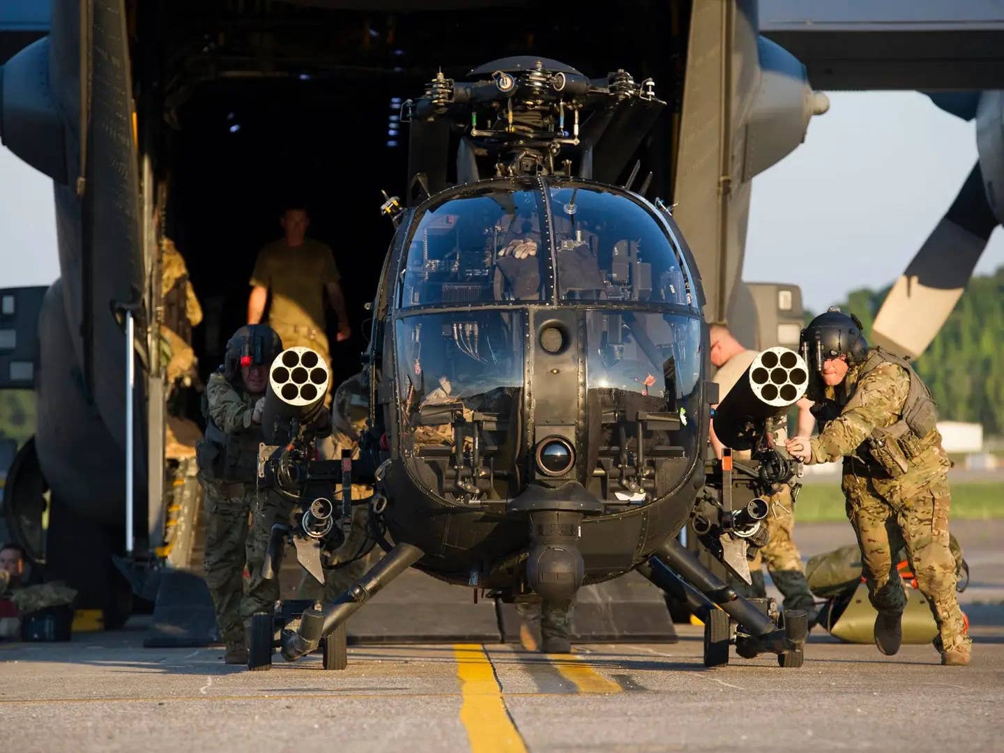 This picture of one of the 160th's AH-6 Little Birds being unloaded from an Air Force MC-130 special operations tanker/transport aircraft perfectly highlighters some of the reasons why the Night Stalkers continue to use these helicopters. <em>DOD</em>