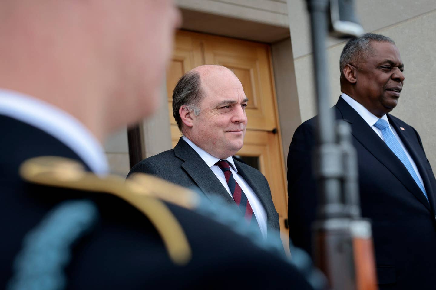British Secretary of State for Defence Ben Wallace (left) is welcomed to the Pentagon in Arlington, Virginia, last month by U.S. Secretary of Defense Lloyd Austin (right). <em>Photo by Win McNamee/Getty Images</em>